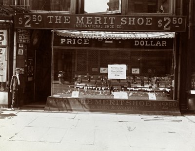 A storefront of the International Shoe Co., New York by Byron Company